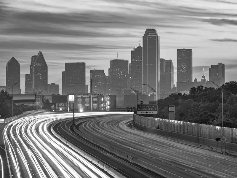 Dallas skyline and highway at dusk